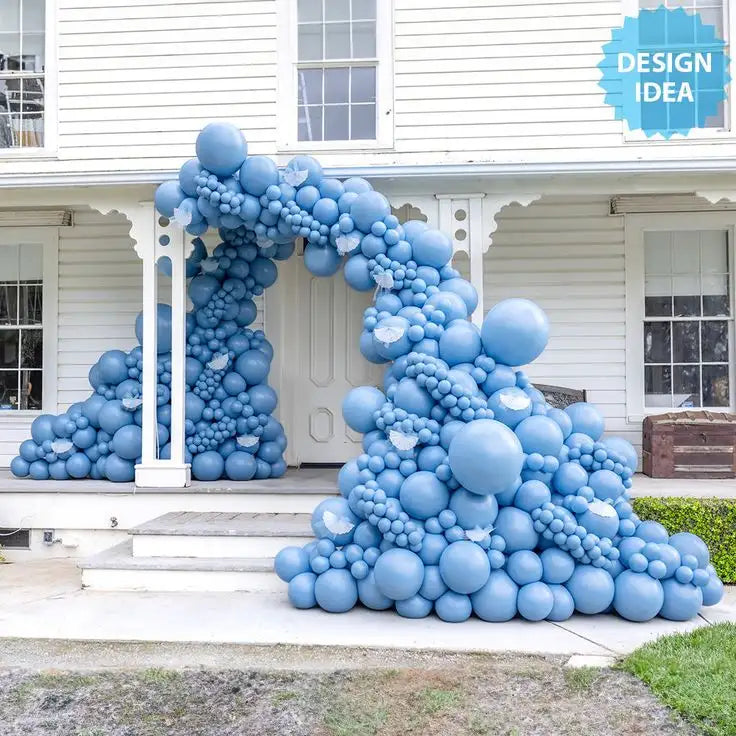 A cascading archway of light blue balloons with white butterfly accents.