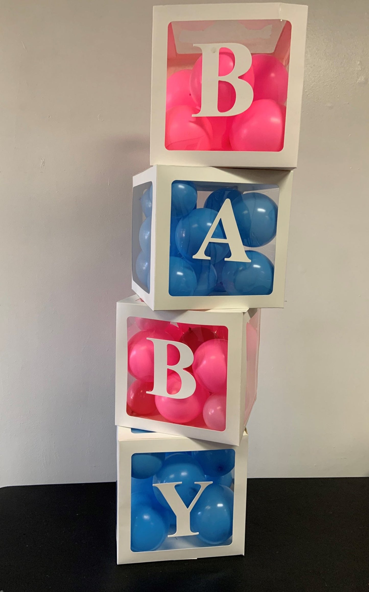 baby shower or gender reveal balloon boxes pink and blue balloons inside