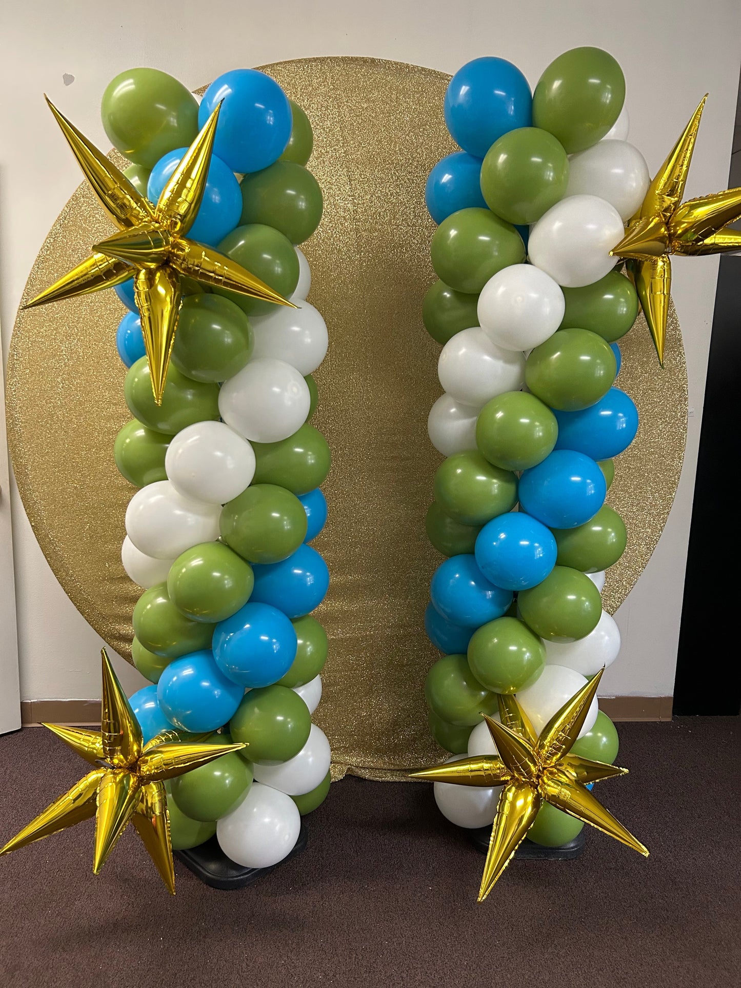 topless balloon column  blue, green and white with gold starburst.