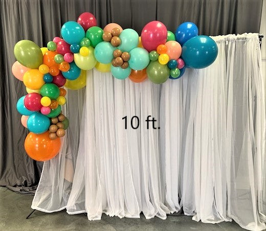 balloon arch garland 10 foot long on white backdrop