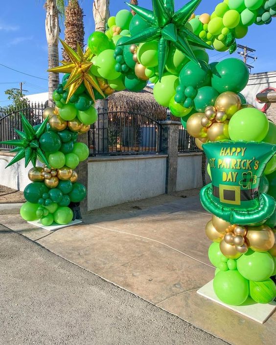 Green St. patricks day balloon arch garland with green latex balloons and starburst