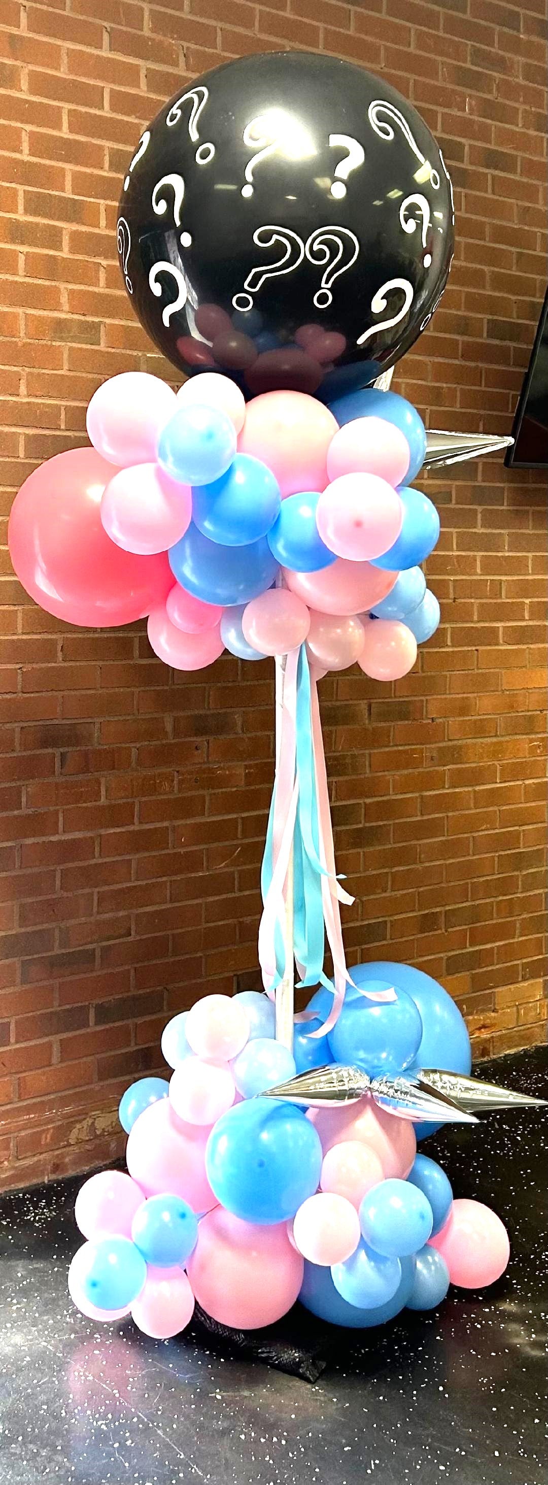 gender reveal with black question mark balloon