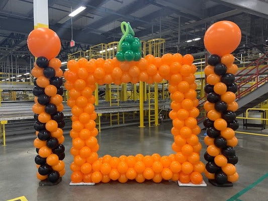 Halloween pumpkin themed balloon picture frame, balloon columns orange and black in Amazon fulfillment