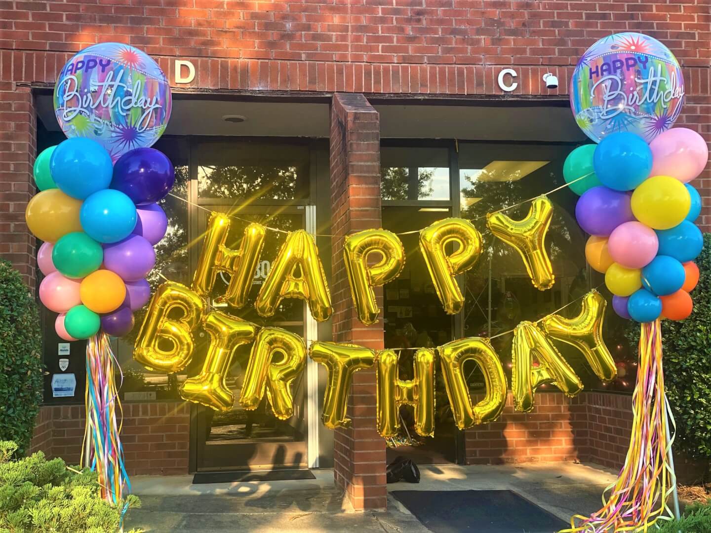 happy birthday banner with balloon columns happy birthday balloons o9n top.
