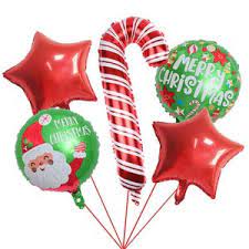 Christmas-themed foil balloons including a candy cane and Santa Claus design  and red stars