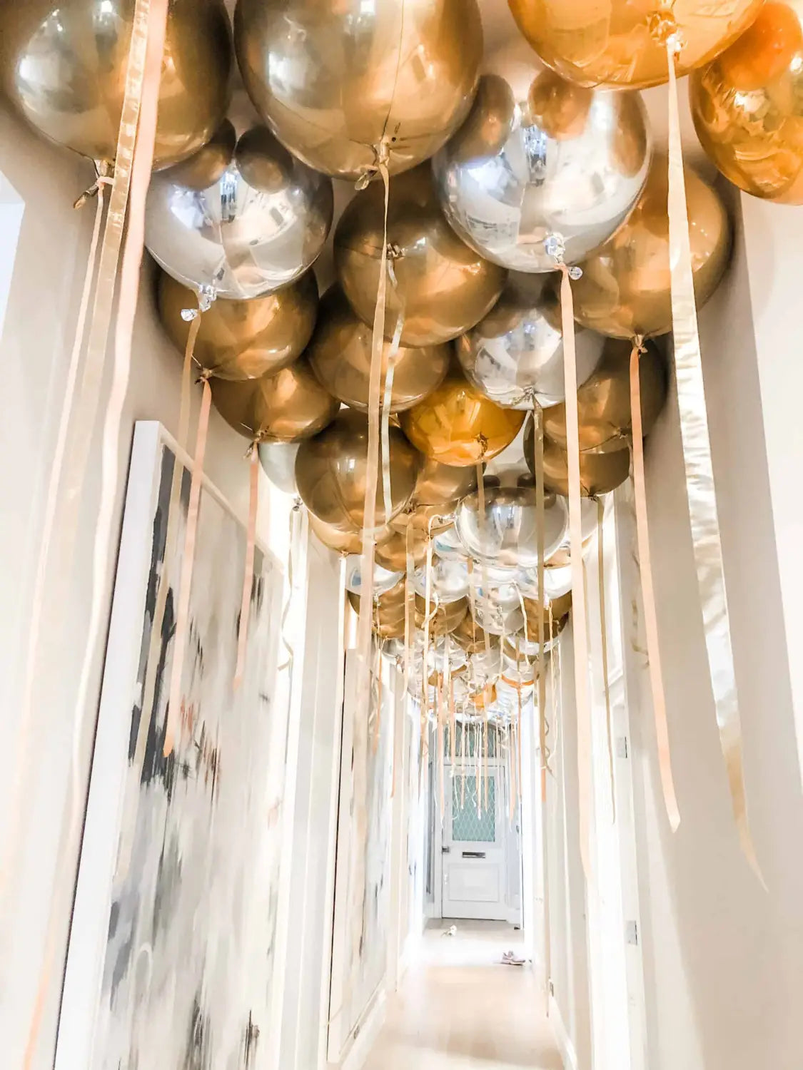 wedding metallic balloons with ribbon floating in ceiling