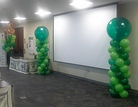 emerald green and lime green classic balloon columns flanking a projector screen